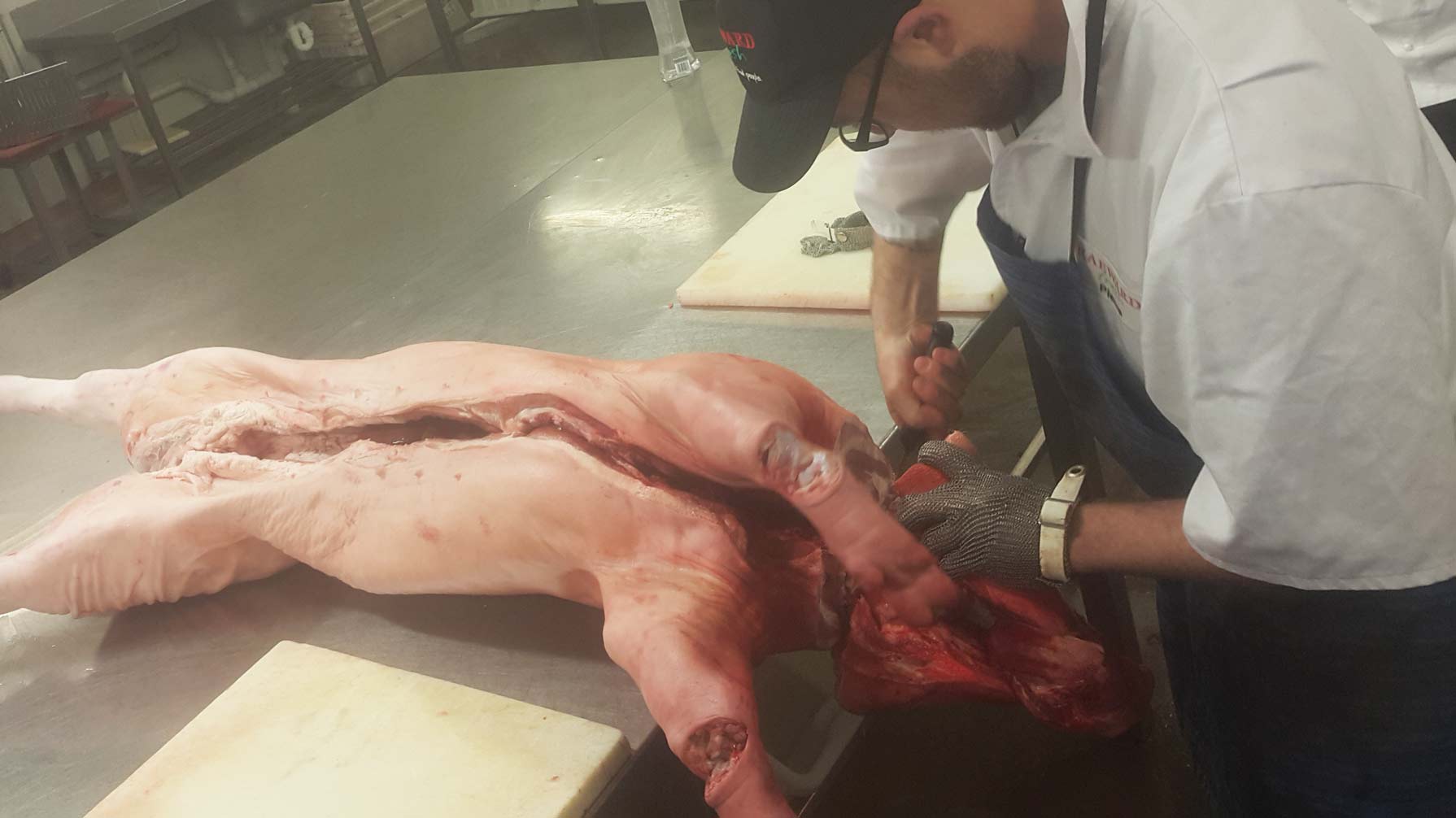 pork meat being cut up